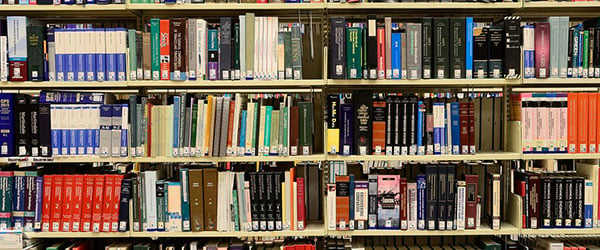 A business coach's experience shown in this vast library of books image