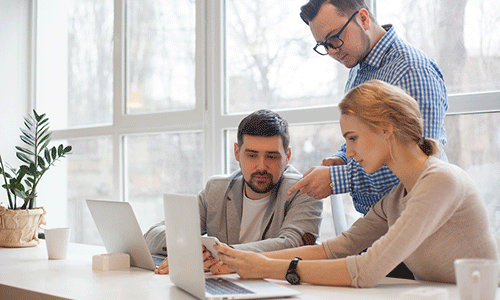 young-male-boss-talking-with-his-two-younger-colleagues-to-ensure-they-are-happy-in-his-workplace.png