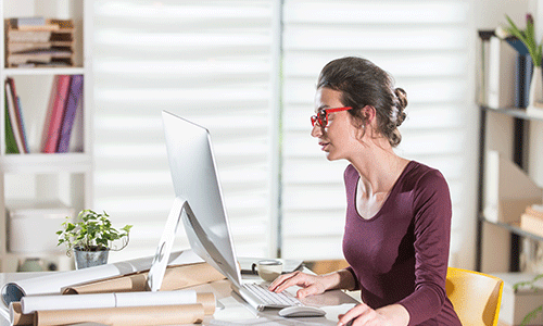 young-woman-working-in-her-home-office.png